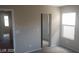 Spacious bedroom with mirrored closet doors at 9229 Millikan Ave, Las Vegas, NV 89148