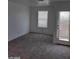 Spacious bedroom with window and door at 9229 Millikan Ave, Las Vegas, NV 89148