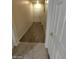 Hallway with wood-look flooring and doors at 9229 Millikan Ave, Las Vegas, NV 89148