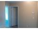 Clean hallway with doors to other rooms at 9229 Millikan Ave, Las Vegas, NV 89148