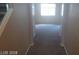 Bright hallway with carpet and doors at 9229 Millikan Ave, Las Vegas, NV 89148