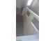 Indoor staircase with window inserts in the wall at 9229 Millikan Ave, Las Vegas, NV 89148