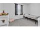 Cozy bedroom with neutral color scheme and carpet flooring at 10664 Sariah Skye Ave, Las Vegas, NV 89166