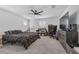 Large bedroom with dark dresser and carpet, creating a comfortable and inviting space at 10664 Sariah Skye Ave, Las Vegas, NV 89166