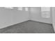 Bright and airy bedroom with multiple windows and carpet flooring at 10664 Sariah Skye Ave, Las Vegas, NV 89166