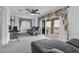 Comfortable bonus room with balcony access and ceiling fan; ideal for casual living at 10664 Sariah Skye Ave, Las Vegas, NV 89166