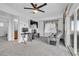 Bright bonus room with computer desk, and sliding doors to balcony offering relaxation and functionality at 10664 Sariah Skye Ave, Las Vegas, NV 89166