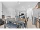 Bright dining area features a gray dining table set, perfect for Gathering meals and entertaining at 10664 Sariah Skye Ave, Las Vegas, NV 89166