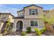 Charming two-story home with a well-maintained front yard, showcasing an inviting exterior at 10664 Sariah Skye Ave, Las Vegas, NV 89166