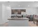 Modern kitchen with stainless steel appliances and granite countertops, offering style and functionality at 10664 Sariah Skye Ave, Las Vegas, NV 89166