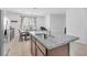 Beautiful kitchen featuring an island with stone countertops and stainless steel appliances at 10664 Sariah Skye Ave, Las Vegas, NV 89166