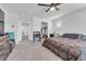 Spacious main bedroom with a ceiling fan and walk in closet at 10664 Sariah Skye Ave, Las Vegas, NV 89166