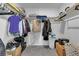 Walk-in closet with built in shelving and organizational system at 10664 Sariah Skye Ave, Las Vegas, NV 89166