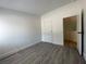 Bright bedroom showcasing light gray vinyl flooring and neutral colored walls at 4281 White Sands Ave, Las Vegas, NV 89121