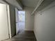 Walk-in closet featuring modern flooring, shelving for storage and an open doorway at 4281 White Sands Ave, Las Vegas, NV 89121