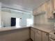 The modern kitchen area offers bar seating and seamless integration with the adjacent living space at 4281 White Sands Ave, Las Vegas, NV 89121