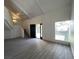 Open living room with stairs and a dark front door with sidelights at 4281 White Sands Ave, Las Vegas, NV 89121