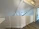 Upstairs loft area featuring bright white walls and vaulted ceilings at 4281 White Sands Ave, Las Vegas, NV 89121