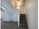 Modern staircase with sleek design, new flooring, and bright lighting at 4281 White Sands Ave, Las Vegas, NV 89121