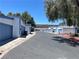 Exterior townhome community featuring garages on quiet street at 4281 White Sands Ave, Las Vegas, NV 89121