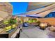Ambient backyard showcasing a water feature, shade, and a cozy fire pit area at 10407 Restless River St, Las Vegas, NV 89141