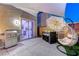Stylish backyard with dining area, egg chair, grill, and covered patio area at 10407 Restless River St, Las Vegas, NV 89141