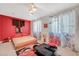 Asian-inspired bedroom featuring red accent wall and decorative window treatments at 10407 Restless River St, Las Vegas, NV 89141