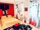 Brightly lit bedroom with traditional decor and a large window at 10407 Restless River St, Las Vegas, NV 89141