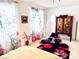Bright bedroom with a view, a small coffee table and a wooden cabinet at 10407 Restless River St, Las Vegas, NV 89141