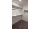 Empty, bright walk-in closet with carpet at 10407 Restless River St, Las Vegas, NV 89141