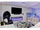 Elegant living room with sleek fireplace, modern décor, and comfortable seating at 10407 Restless River St, Las Vegas, NV 89141