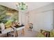Bright office space with a desk, a forest mural, and a chandelier at 10407 Restless River St, Las Vegas, NV 89141