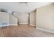 Spacious living room with hardwood floors and a staircase at 5543 Cortu Ave, Las Vegas, NV 89141