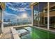 Balcony featuring a jacuzzi, city views, and an expansive sliding glass door at 3111 Bel Air Dr # 28C, Las Vegas, NV 89109