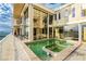 Spacious balcony with jacuzzi, patio furniture, and stunning city views through expansive windows at 3111 Bel Air Dr # 28C, Las Vegas, NV 89109