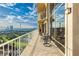 Enjoy the scenery of the city skyline from your balcony with comfortable seating and views of the pool and putting green at 3111 Bel Air Dr # 28C, Las Vegas, NV 89109