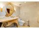 Stylish bathroom with a decorative mirror, elegant vanity, and tiled walls at 3111 Bel Air Dr # 28C, Las Vegas, NV 89109