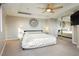 This bedroom is bright and spacious, featuring a ceiling fan, a wall mirror, and a large window for plenty of natural light at 3111 Bel Air Dr # 28C, Las Vegas, NV 89109