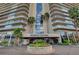 The Regency Towers entrance features beautiful landscaping and a welcoming circular driveway at 3111 Bel Air Dr # 28C, Las Vegas, NV 89109