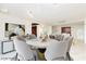 Elegant dining room with a round marble table, plush chairs, and stylish decor for sophisticated gatherings at 3111 Bel Air Dr # 28C, Las Vegas, NV 89109