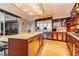 Modern kitchen with a center island, stainless steel appliances, and rich wood cabinetry, creating a chef's dream at 3111 Bel Air Dr # 28C, Las Vegas, NV 89109