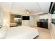 Bright main bedroom with a fan, TV, mirrored closet and views of the Las Vegas Strip through the large windows at 3111 Bel Air Dr # 28C, Las Vegas, NV 89109