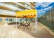 Relaxing patio featuring sitting area, overhead cover, and view of community area at 3111 Bel Air Dr # 28C, Las Vegas, NV 89109