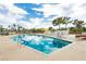 Community pool featuring crystal clear water, lounge seating, and beautiful palm trees at 3111 Bel Air Dr # 28C, Las Vegas, NV 89109