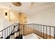 Elegant staircase with unique hanging light fixtures and a modern railing design at 3111 Bel Air Dr # 28C, Las Vegas, NV 89109