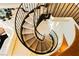 Unique curving staircase from above showcasing wrought iron railings and recessed lighting fixtures at 3111 Bel Air Dr # 28C, Las Vegas, NV 89109
