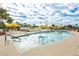 Enjoy this beautiful pool area featuring ample seating, umbrellas, palm trees, and views of the city skyline at 3111 Bel Air Dr # 28C, Las Vegas, NV 89109