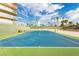 Community tennis court featuring professional net, and building in background at 3111 Bel Air Dr # 28C, Las Vegas, NV 89109