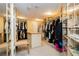 Well-organized walk-in closet with custom shelving, hanging rods, and ample storage for clothes and accessories at 3111 Bel Air Dr # 28C, Las Vegas, NV 89109