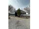 Single-story home featuring a porch and low maintenance gravel landscaping at 1130 N Leslie St, Pahrump, NV 89060